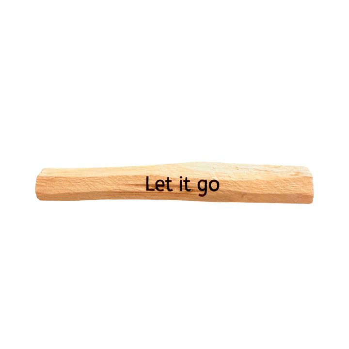 one stick of palo santo with the phrase Let It Go engraved on it.