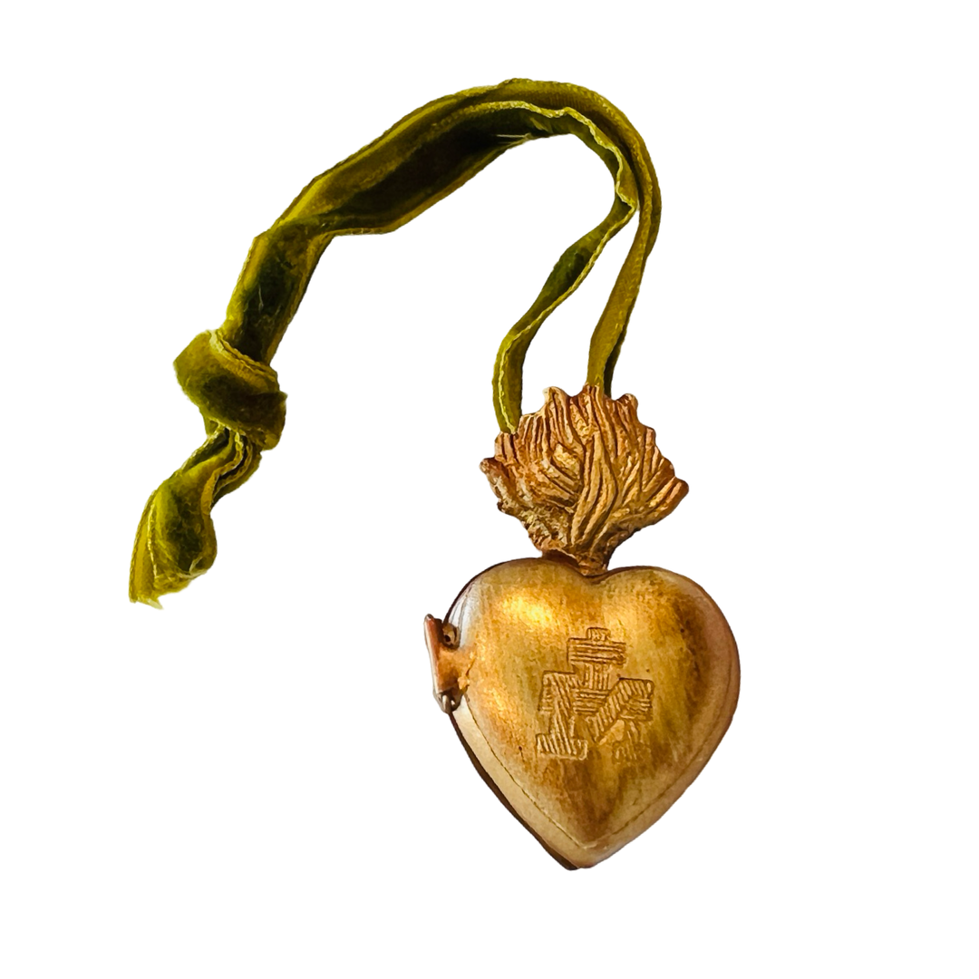 brass heart locket with a green velvet hanging loop