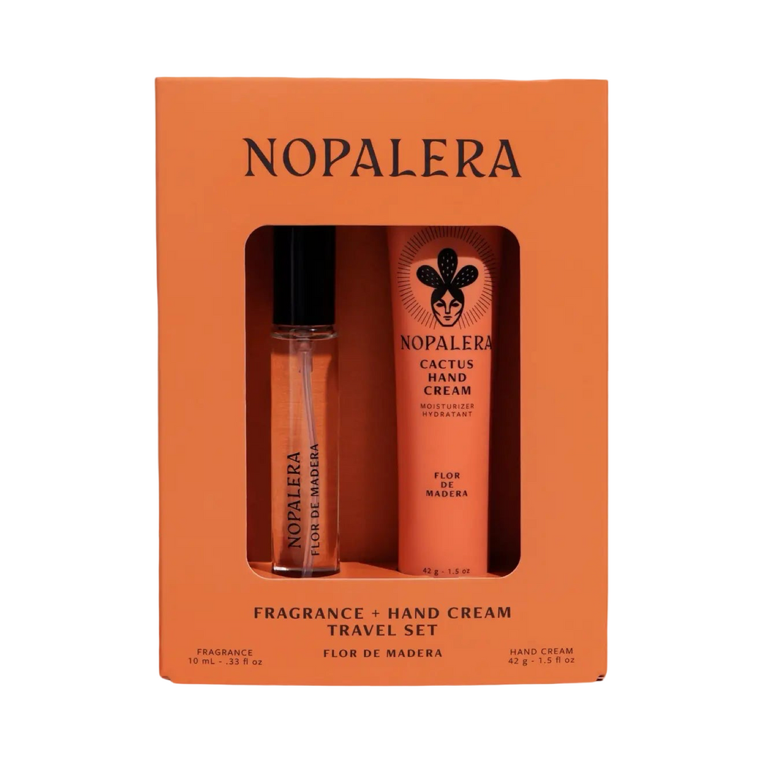 Orange gift box containing Nopalera Flor De Madera cactus hand cream and matching travel fragrance roller displayed side by side.