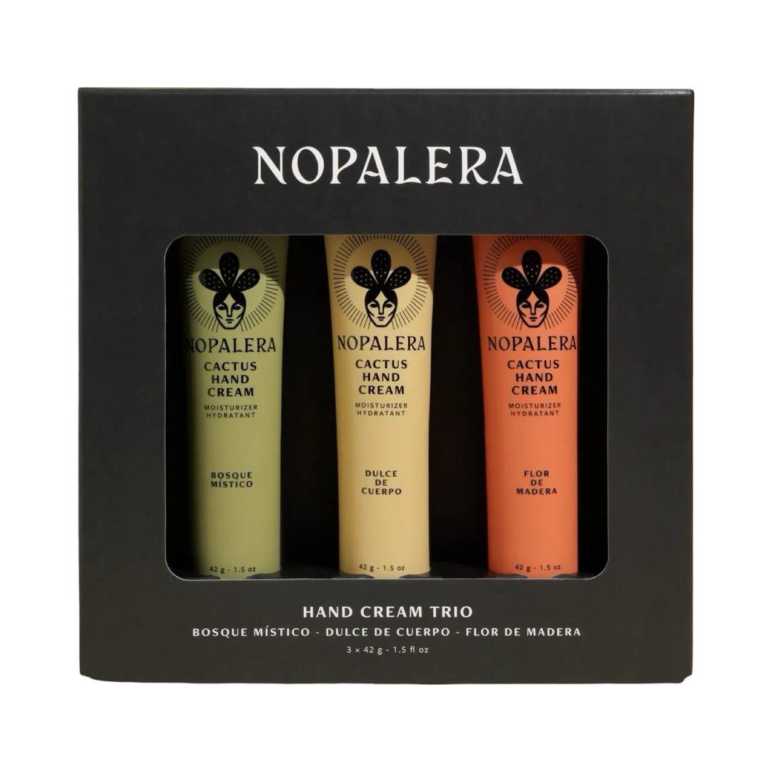 Black gift box containing three Nopalera cactus hand creams in green, cream, and orange tubes labeled Bosque Místico, Dulce de Cuerpo, and Flor de Madera.