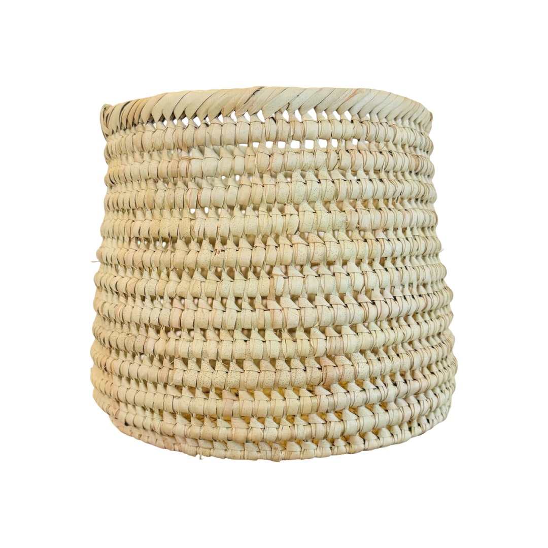 A round handwoven natural palm leaf basket.