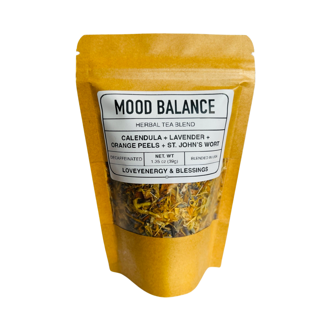 1.35 oz kraft pouch of tea featuring dried calendula, orange peels, st. john's wort and lavender with a white branded label. Brand: Loveyenergy & Blessings