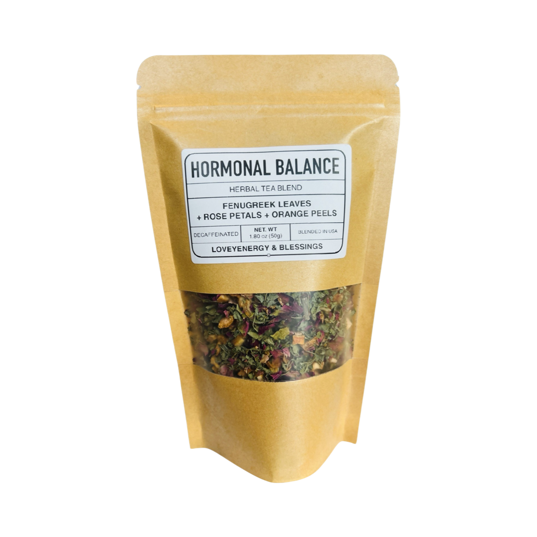 1.80 oz kraft pouch of tea featuring dried rose petals, orange peels and fenugreek leaveswith a white branded label. Brand: Loveyenergy & Blessings