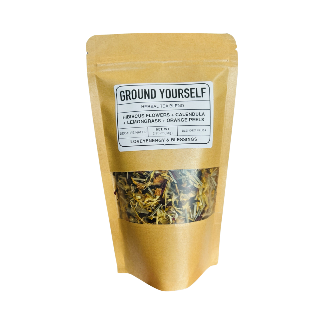 2.85 oz kraft pouch of tea featuring dried hibiscus fowers, calendula, lemongrass and orange peels with a white branded label. Brand: Loveyenergy & Blessings