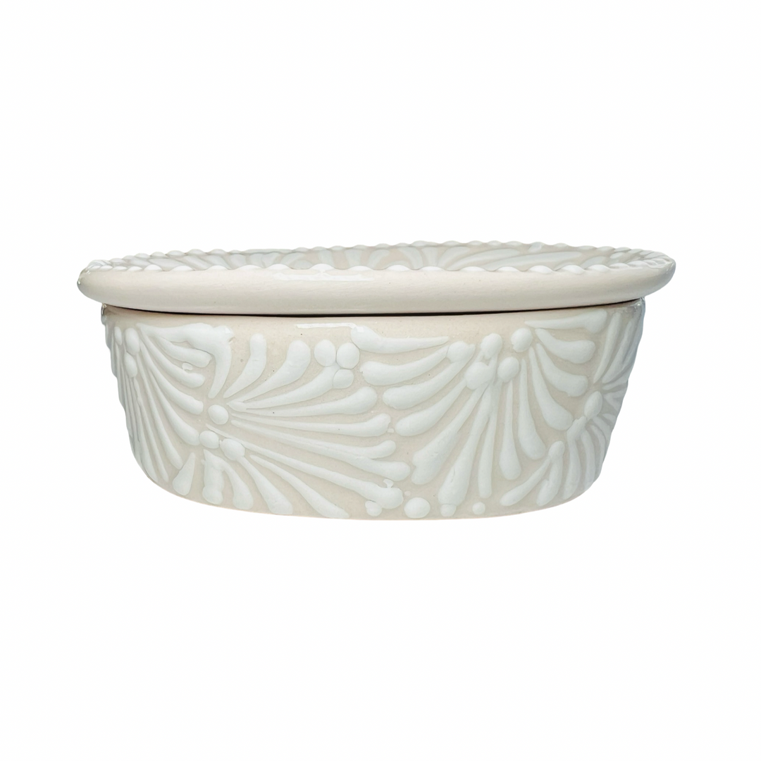 side view of a Puebla soap dish with a white and cream glazed design