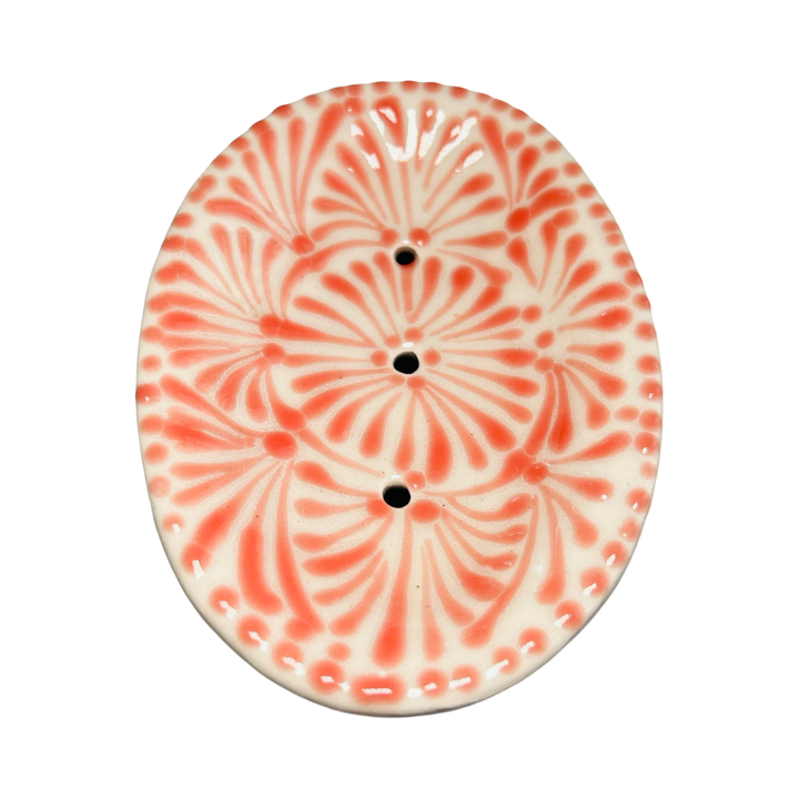 top view of a Puebla soap dish with a white and coral glazed design.