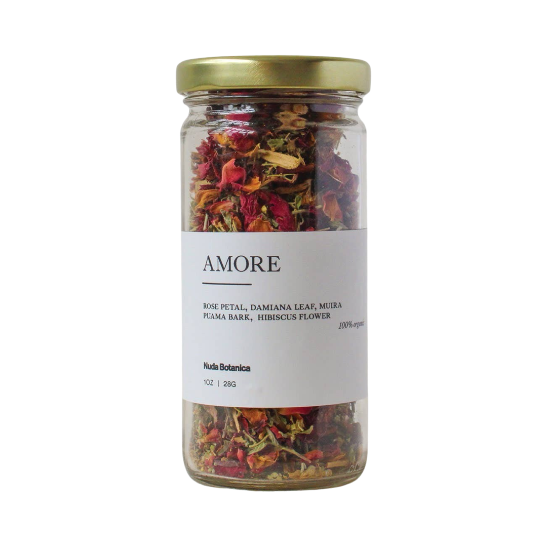 1 oz clear jar of dried Rose Petals, Hibiscus flower, Damiana leaves tea with a white branded label with black lettering. Brand: Nuda Botanica