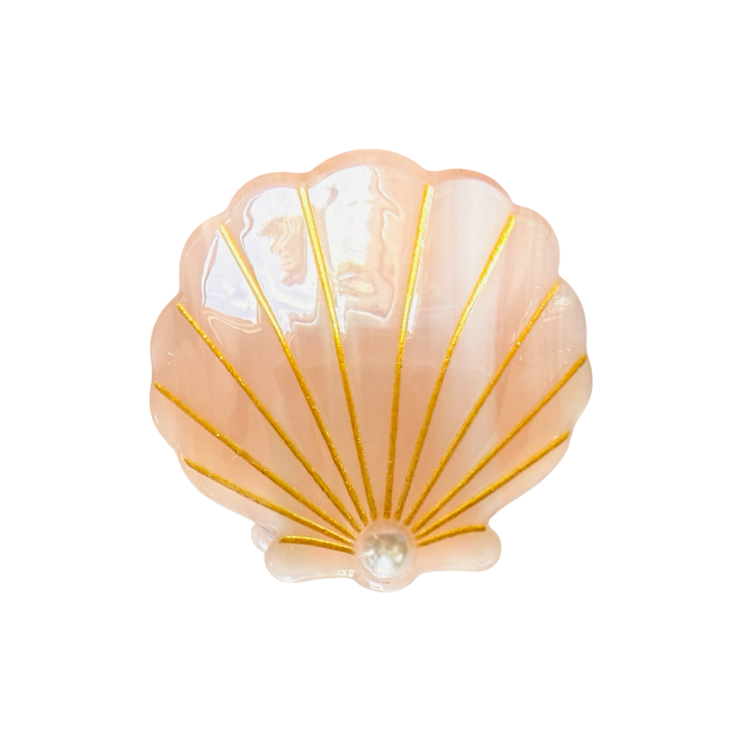 Peachy pink Iridescent seashell-shaped hair claw clip with gold detailing and a pearl accent.