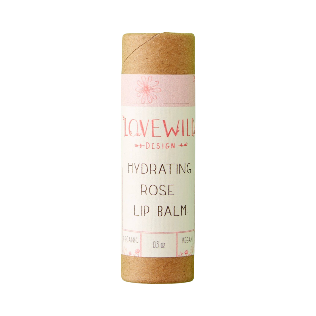 .3 oz kraft tube of lip balm with a white branded label featuring a pink band with a flower sketch.. Brand: Lovewild Design