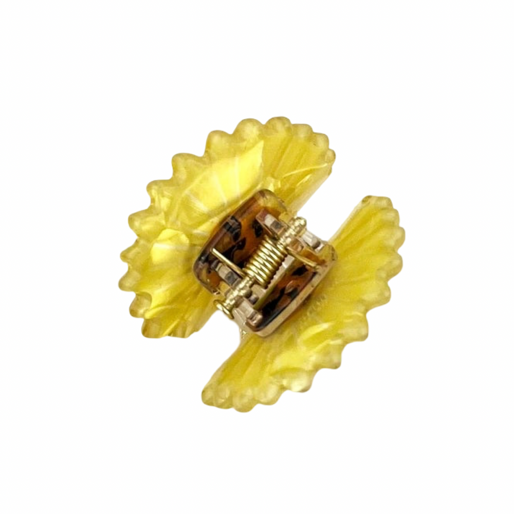 Yellow translucent mini daisy hair claw clip with a detailed brown center.