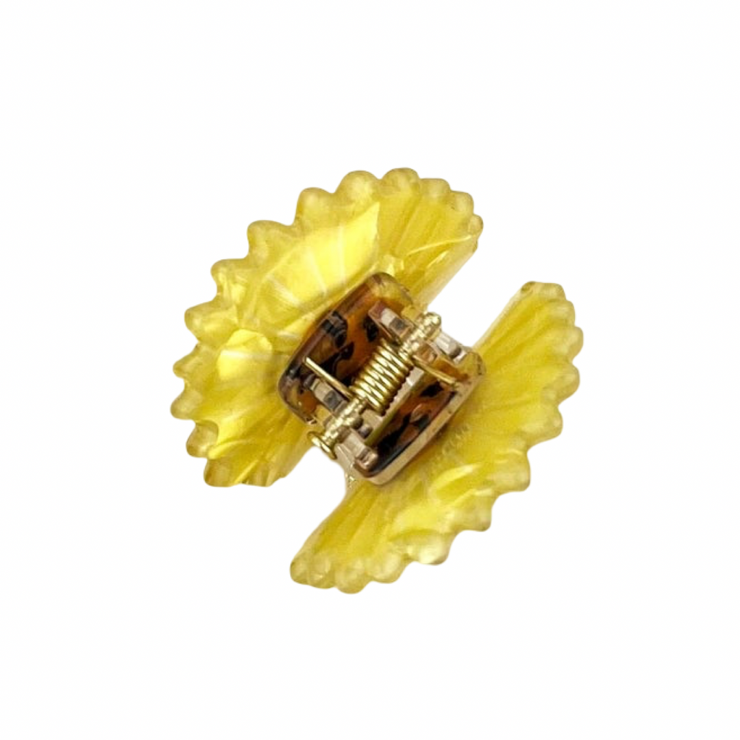 Yellow translucent mini daisy hair claw clip with a detailed brown center.