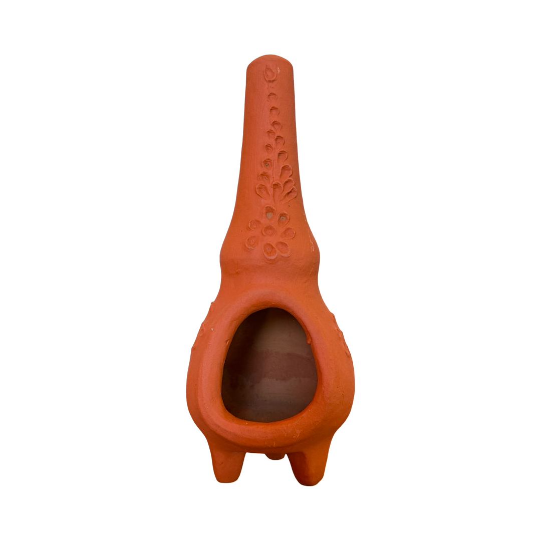 Handmade terracotta clay chiminea with embossed floral and dot motif.
