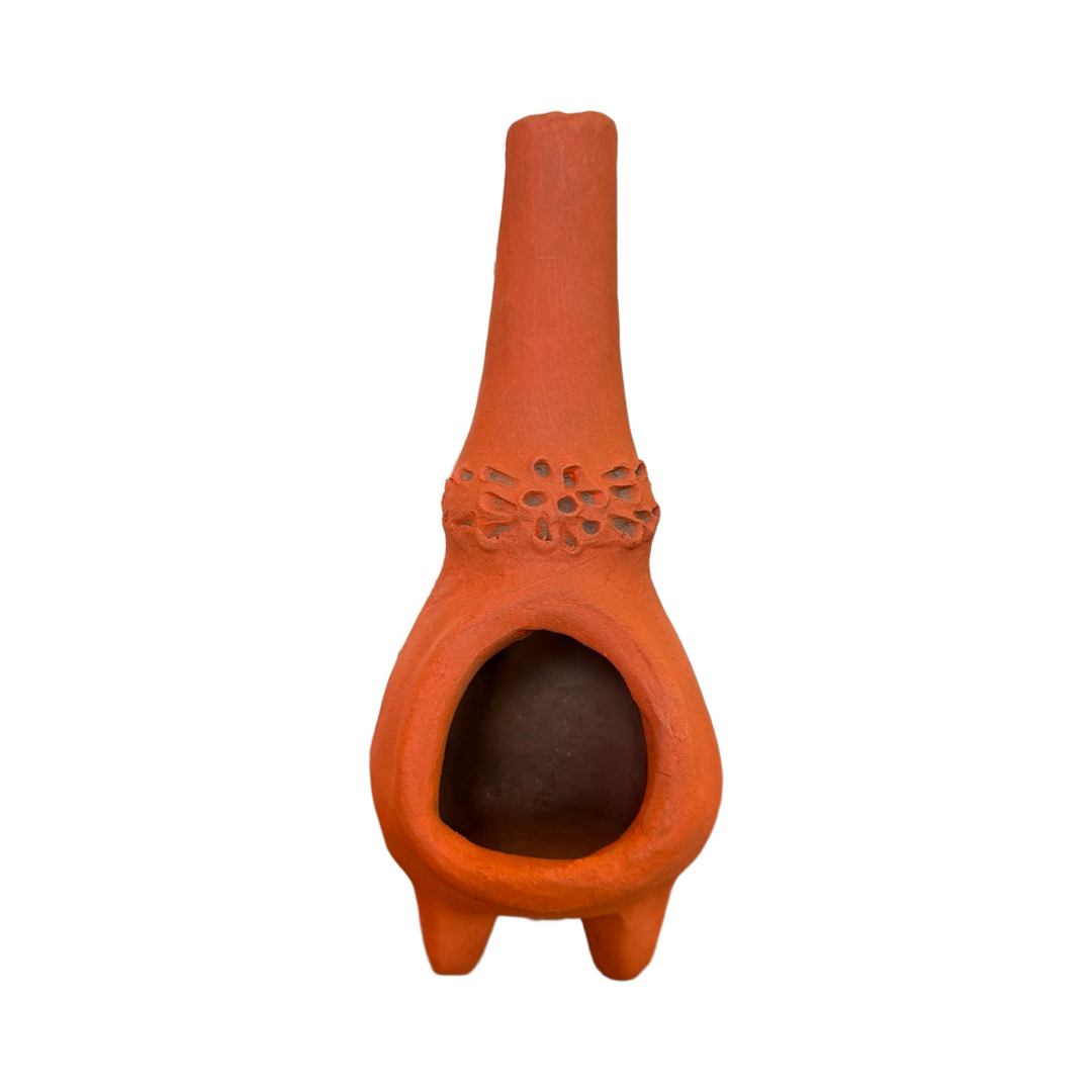 Handmade terracotta clay chiminea with embossed floral and dot motif.