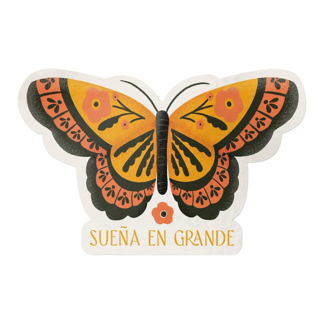 Monarch butterfly with the phrase Sueña En Grande in orange lettering