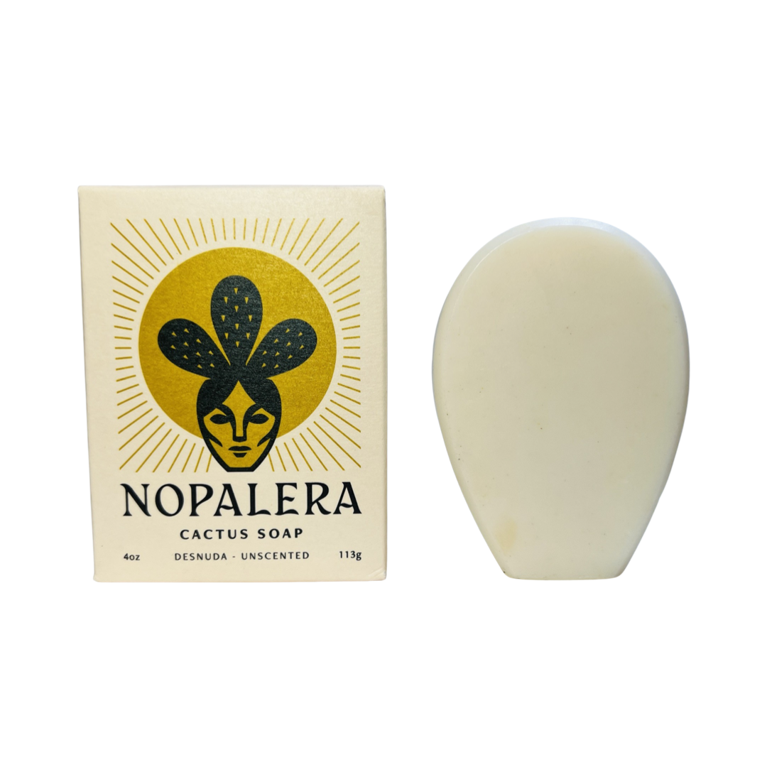 Cream colored branded box of cactus soap on the side of a cream cactus shaped bar of soap. Brand: Nopalera