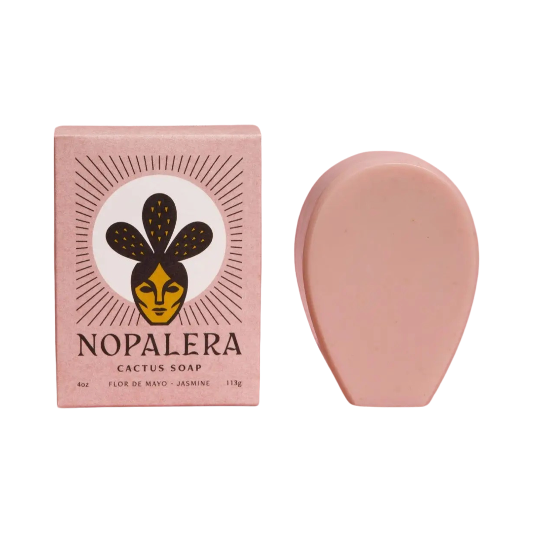 blush colored branded box of cactus soap on the side of a blush cactus shaped bar of soap. Brand: Nopalera