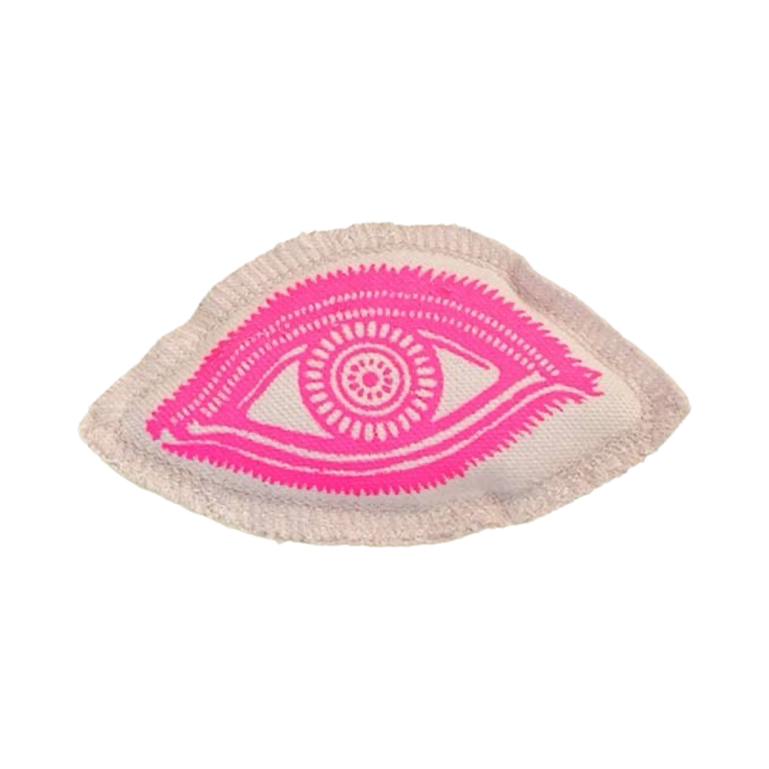 cream sachet with a hot pink eye