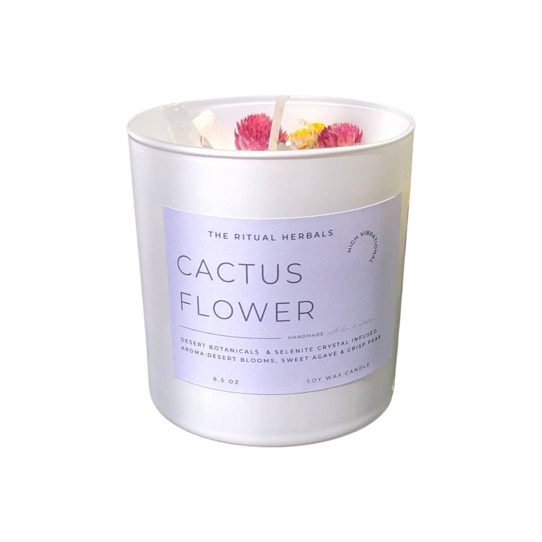 8.5 oz white glass vessel candle featuring dried flowers and crystals on the top with a white branded label