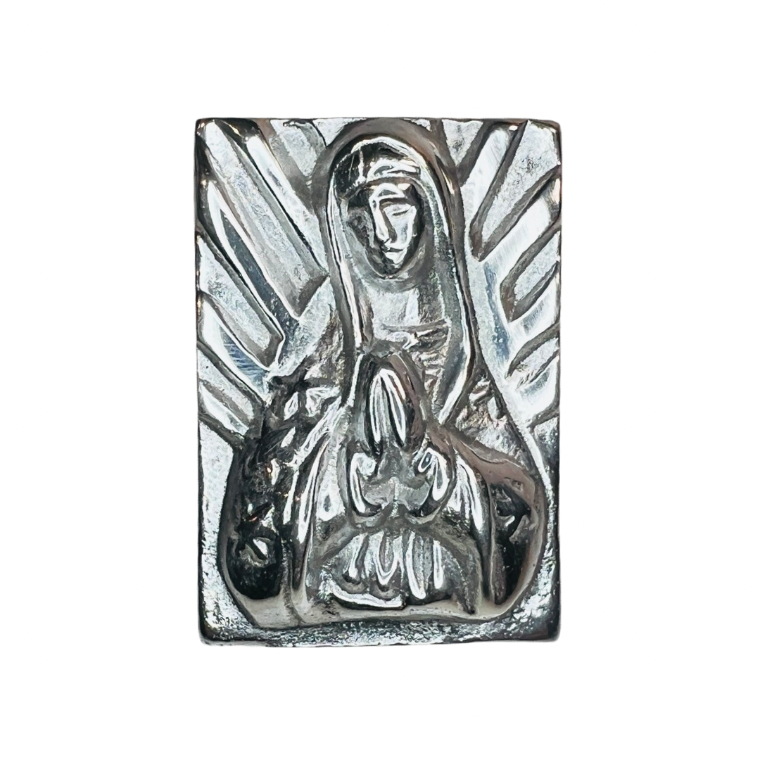 top view of a pewter trinket box with an image of Our Lady of Guadalupe