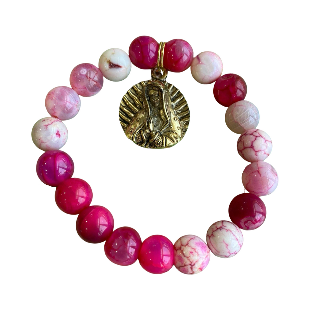 pink agate beaded bracelet with a brass Our Lady of Guadalupe charm