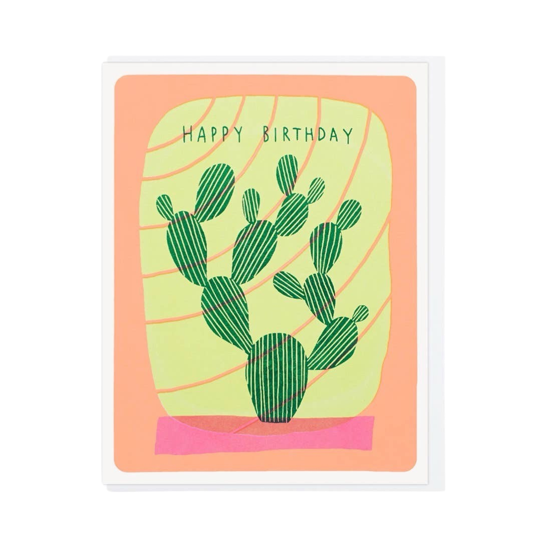 White and orange card with an illustration of a cactus that features a yellow background with orange lines and the phrase Happy Birthday in green lettering.