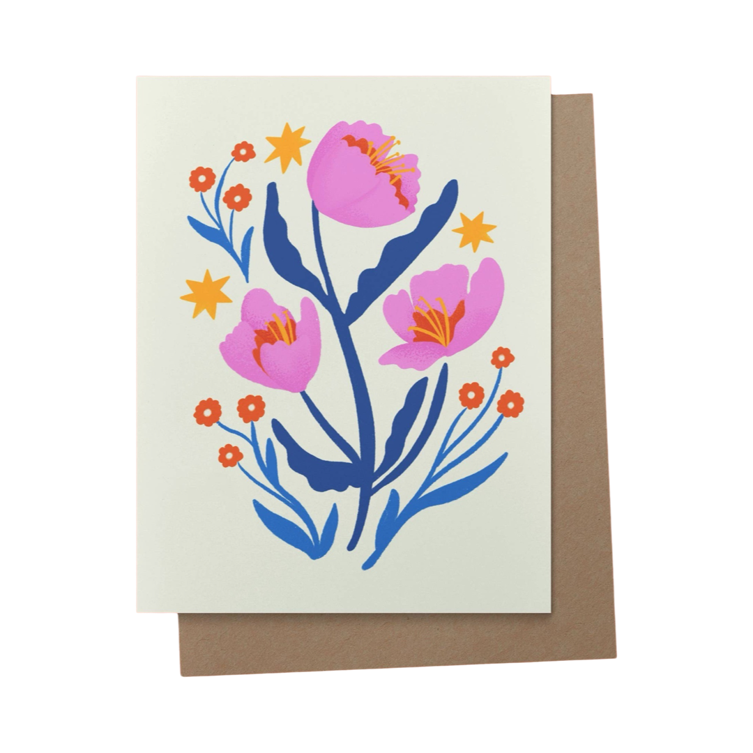 brown envelope behind acream card with a pink and blue flower design