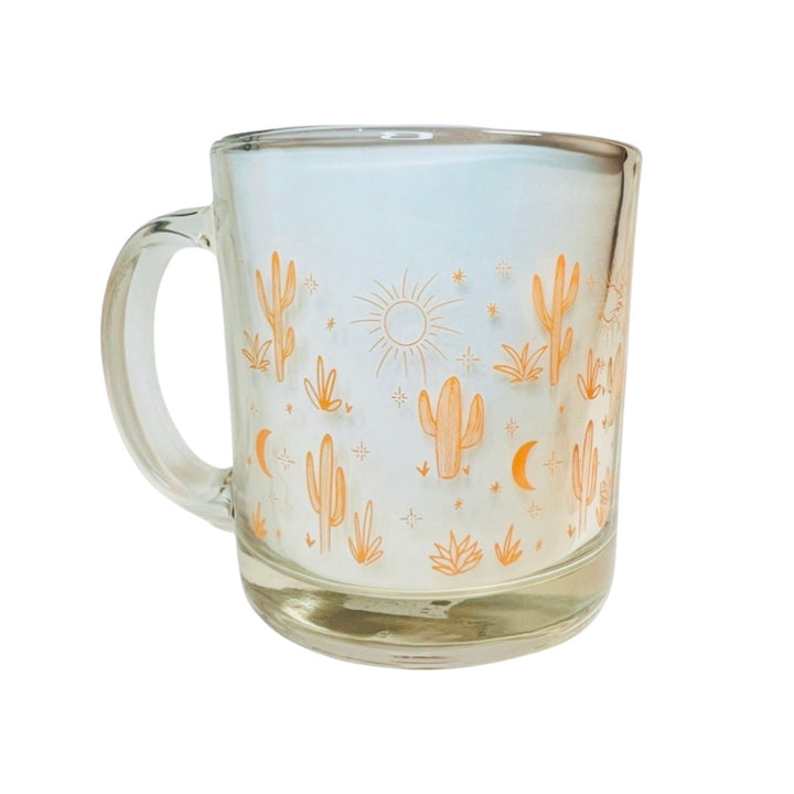 clear glass mug featuring an orange cacti and design