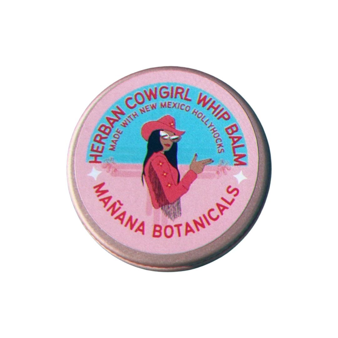 round tin with a pink a blue branded label that featurs a woman wearing a pink fringed jacket, pink cowgirl hat and sunglasses.