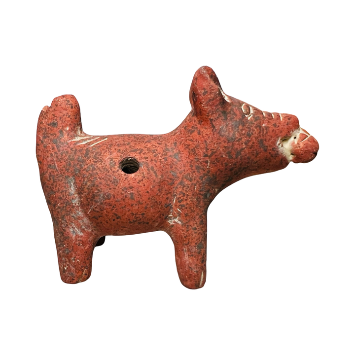 side view of a red clay dog figurine