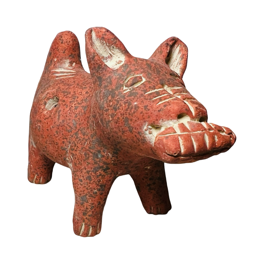 side view of a red clay dog figurine