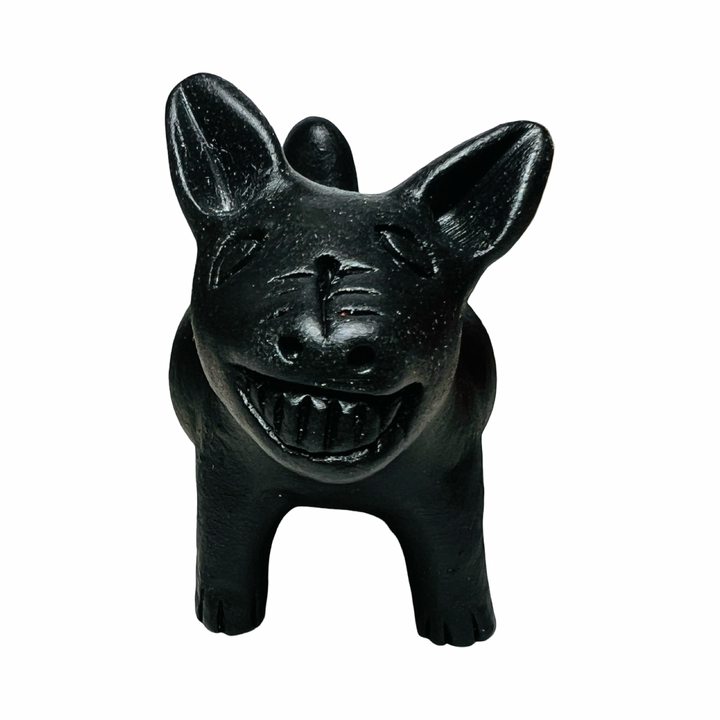 front view of a black clay dog figurine