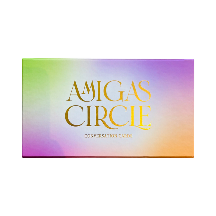 rectangle branded box with purple, green and orange ore colors and Amigas Circle Conversation Cards in gold lettering