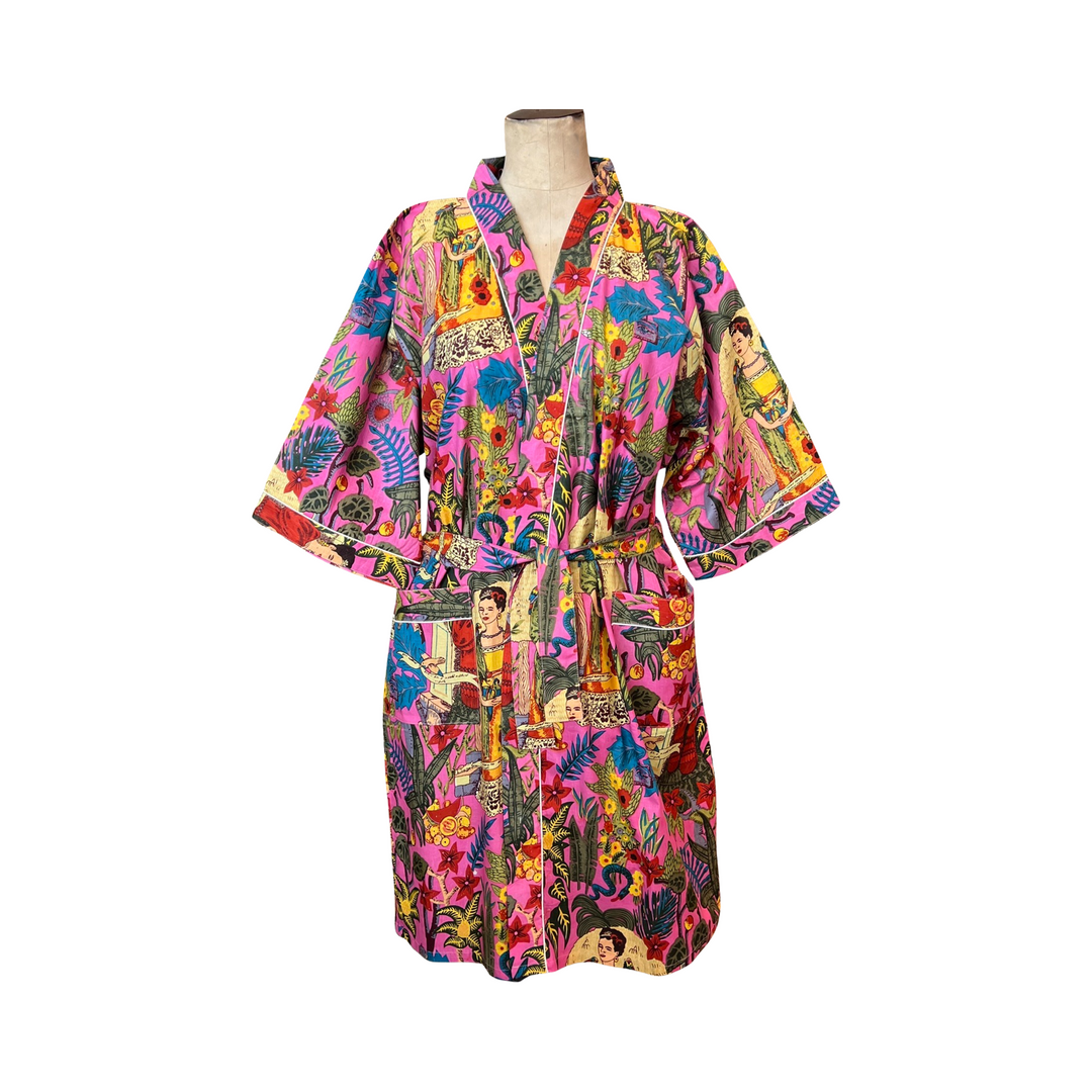 pink robe with images of Frida Kahlo and tropical setting.