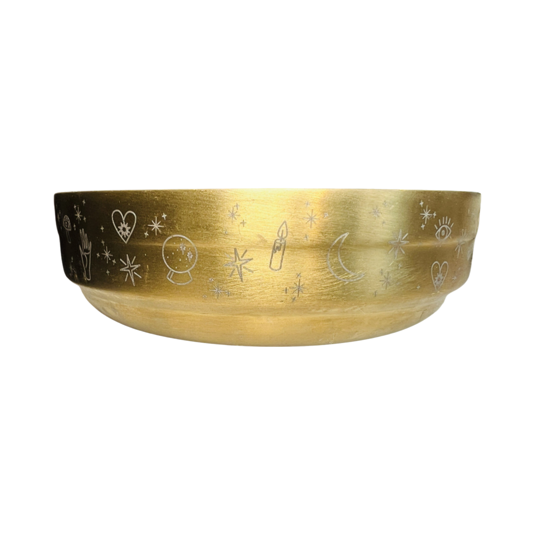 brass bowl with etched images of stars, moon, hearts, palm, candles and crystal ball
