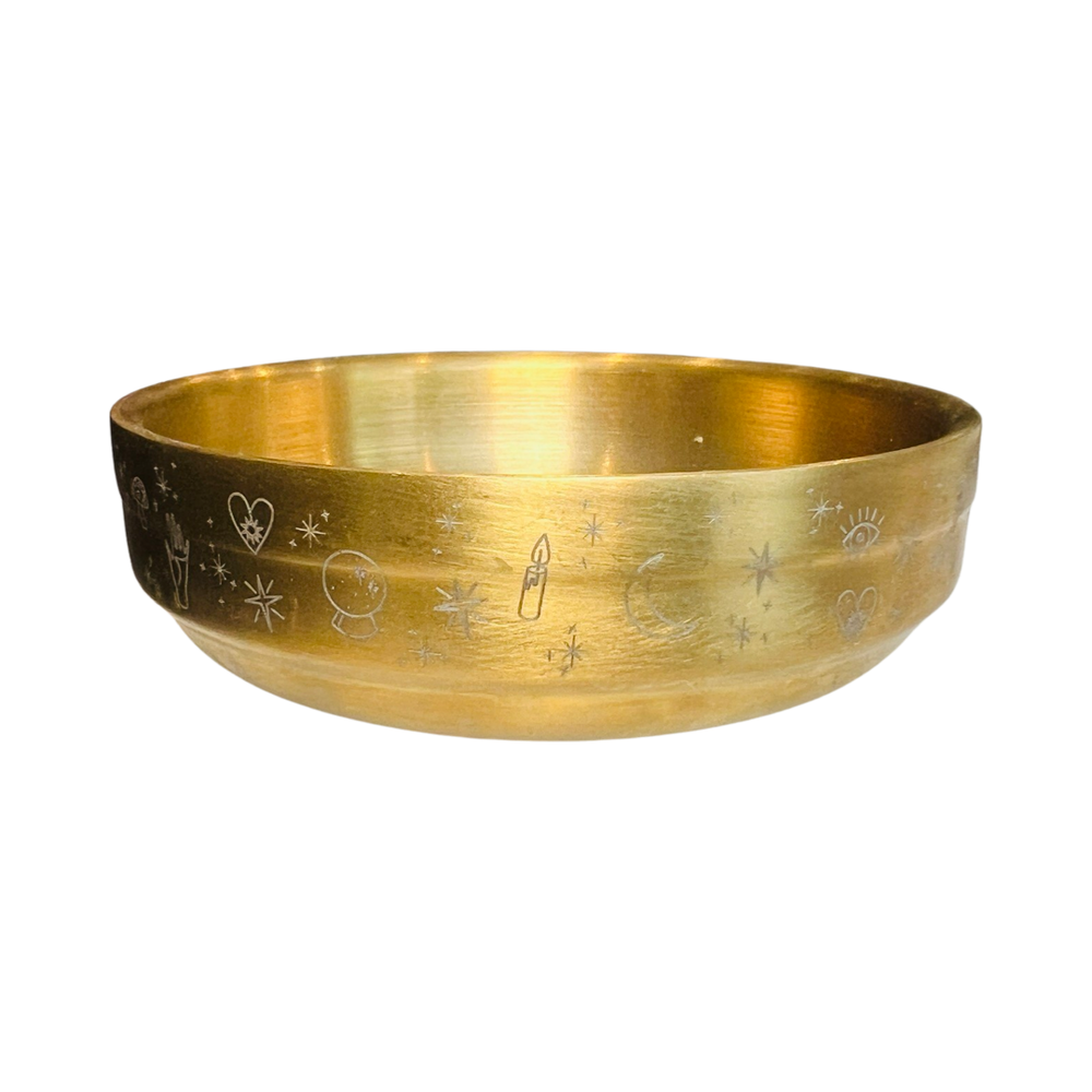 brass bowl with etched images of stars, moon, hearts, palm, candles and crystal ball