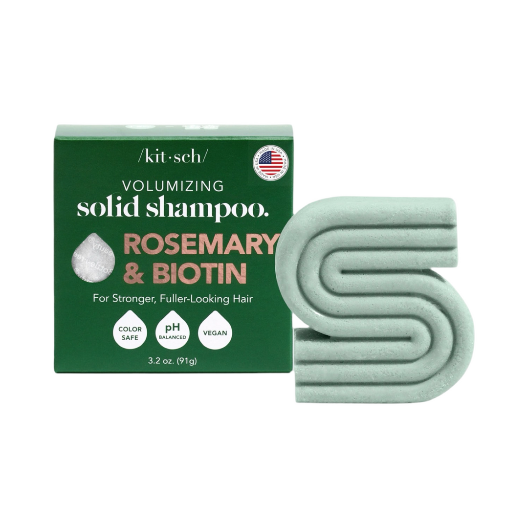 dark green branded box with a mint green "S" shaped bar of shampoo