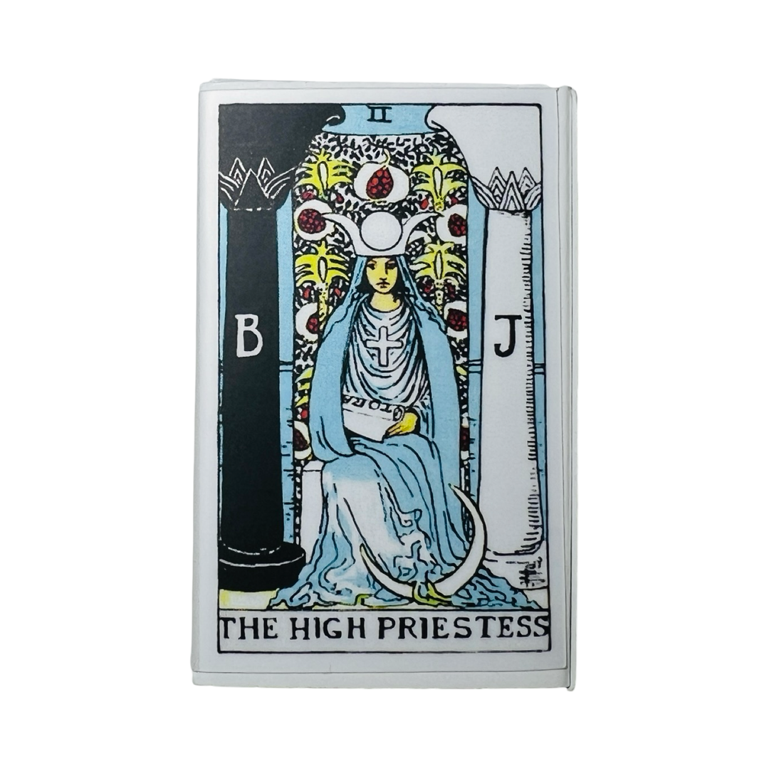 matchbox with an image of the High Priestess tarot card featuring a woman wearing a blue dress with a moon.