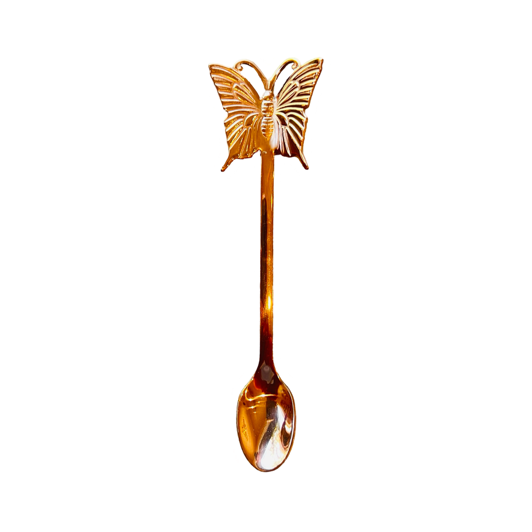 rose gold spoon with a butterfly on the end.