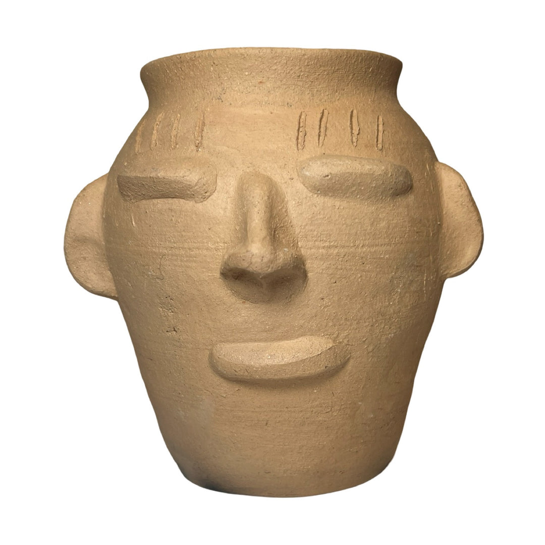 barro clay pot with a face design