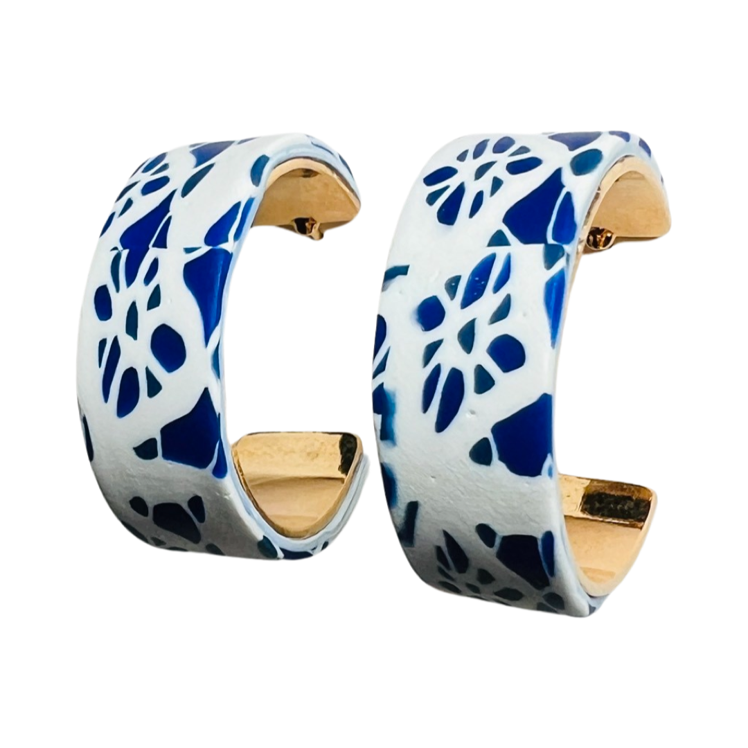 Photo of white hoop earrings with blue detail design