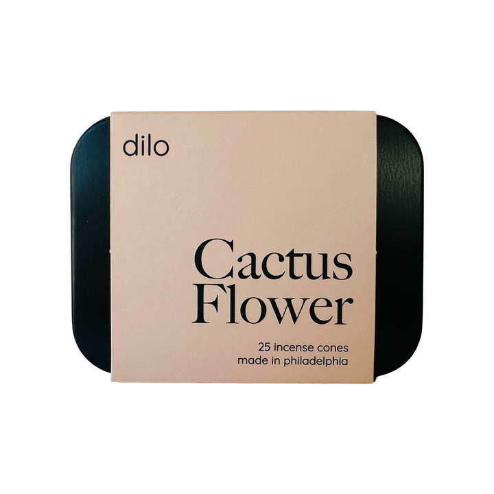 black rectangle tin with a blush branded label with the phrase Cactus Flower in black lettering