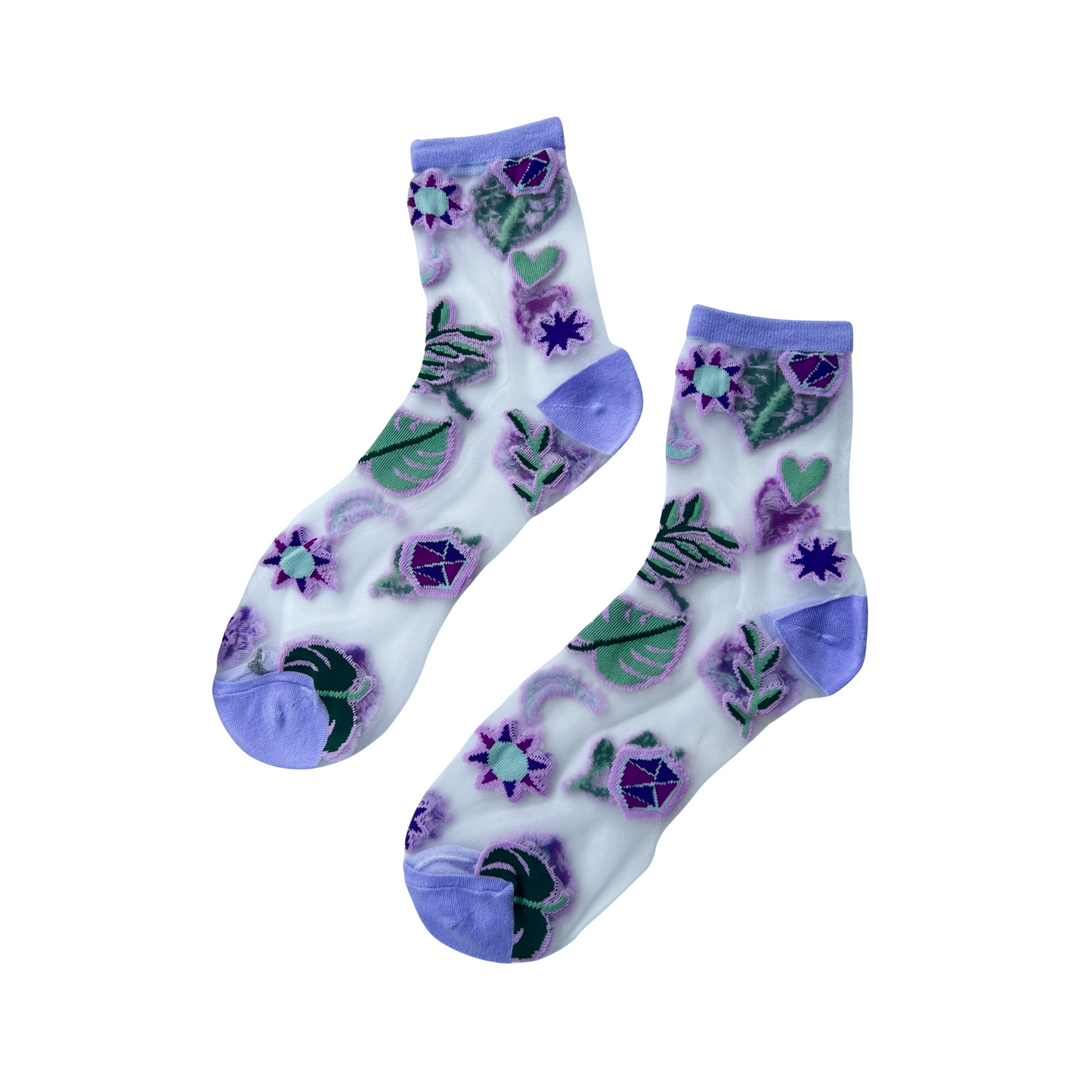 Pair of mesh socks with purple flowers and purple blocks at the toe and ankle area. 