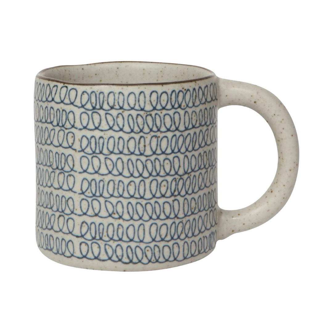 gray stone colored mug with a blue scribble design.