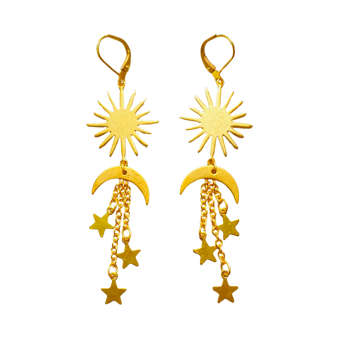 a set of gold brass moon and star dangle earrings