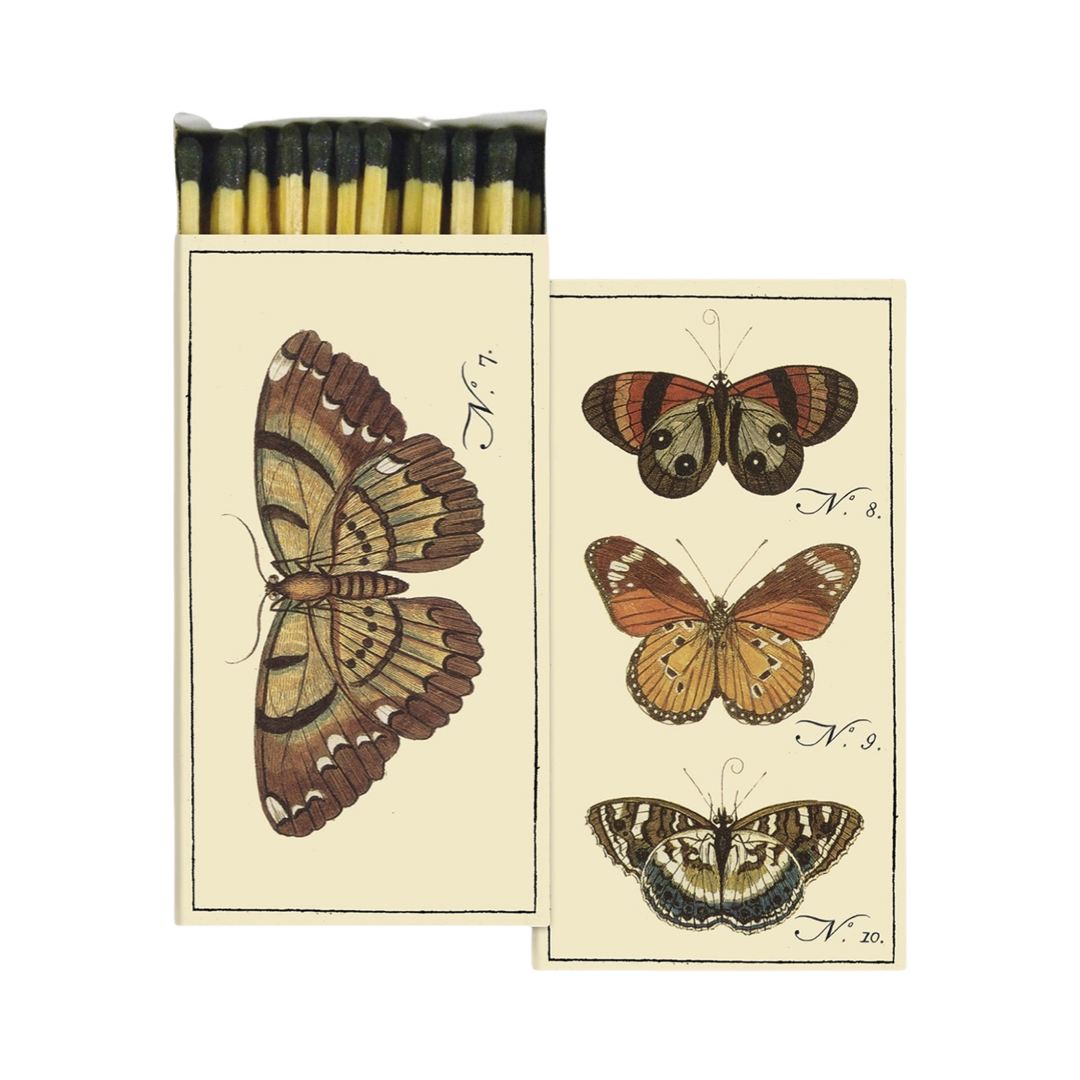 2 beige boxes of matches with images of various butterflie with on box opened with matches.