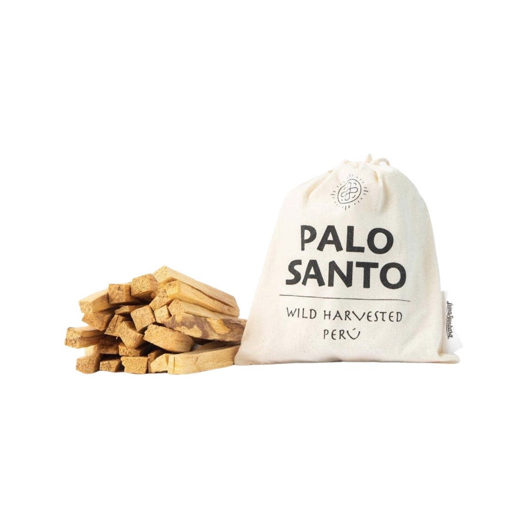 Palo santo smudging sticks next to branded cloth bag. Brand: Luna Sundara