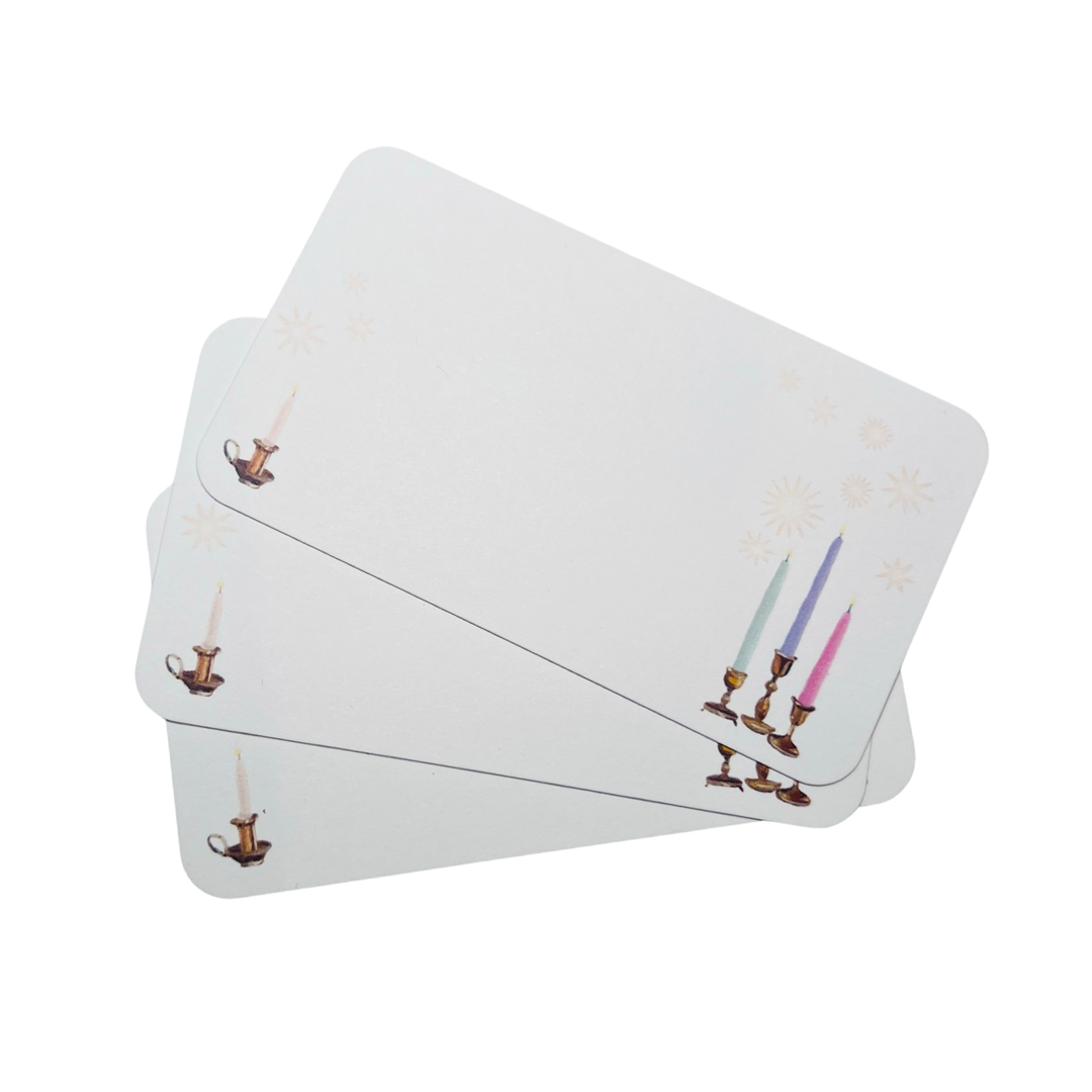 3 stacked white blank cards with images of candles in candlestick holders.