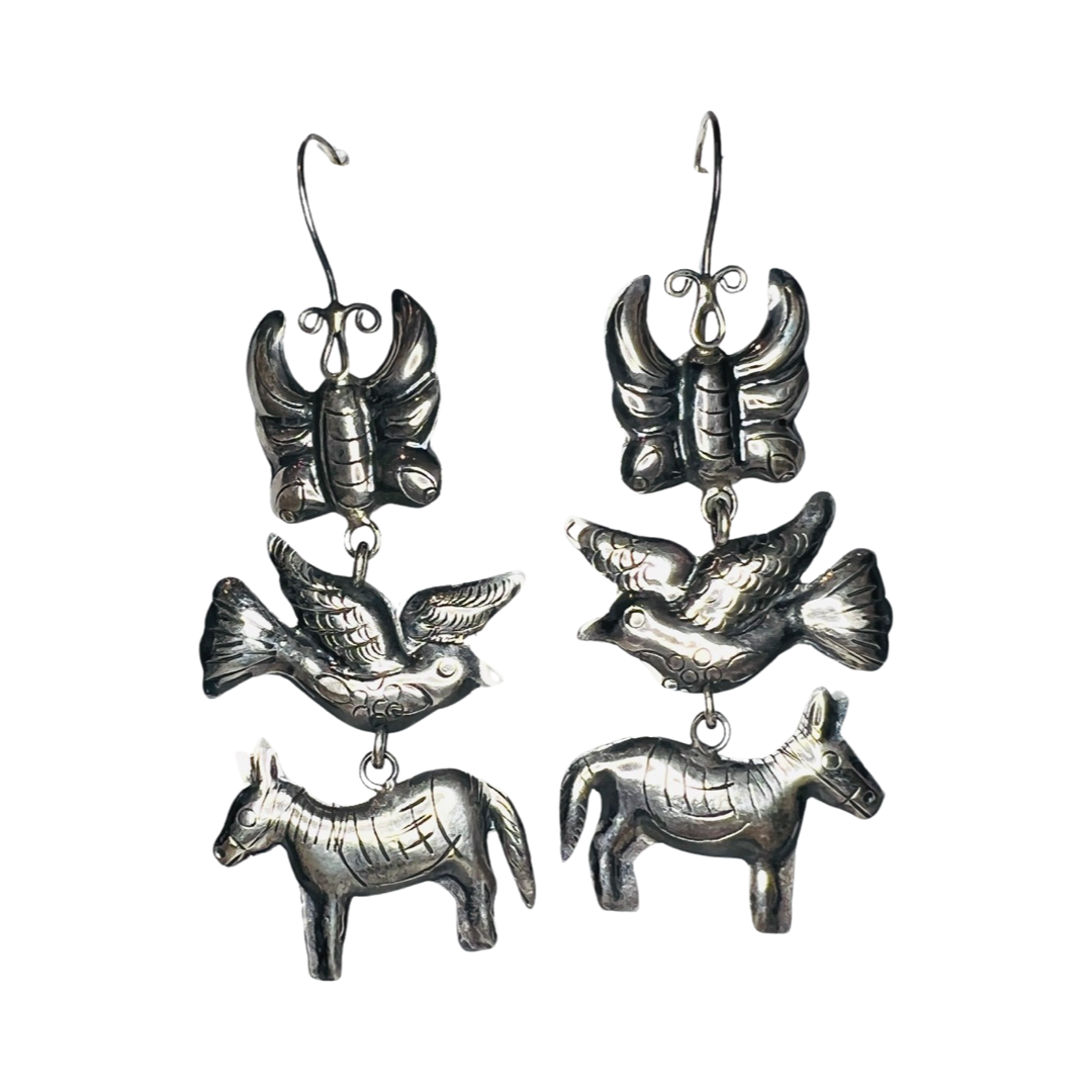 set of silver dangle earrings featuring a butterfly, donkey and bird charm