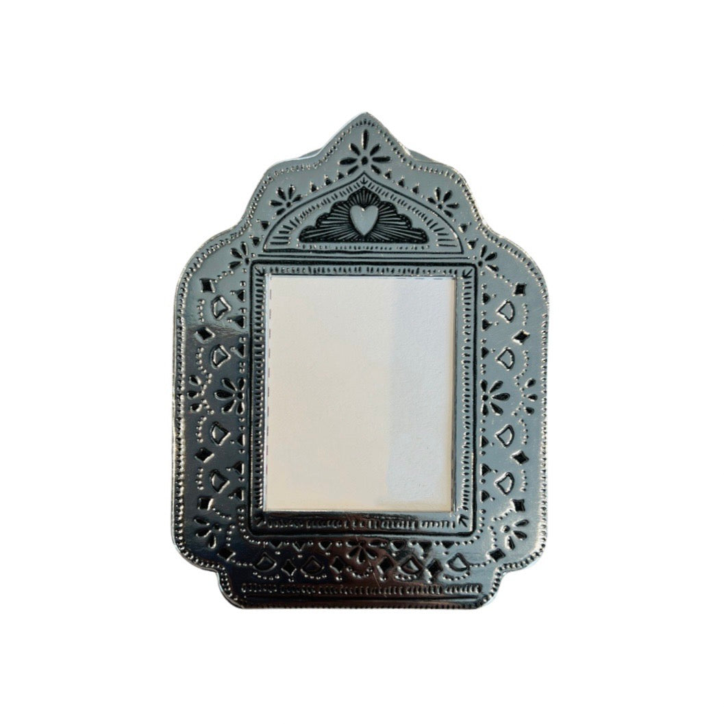 silver faux tin frame featuring a heart on the top center