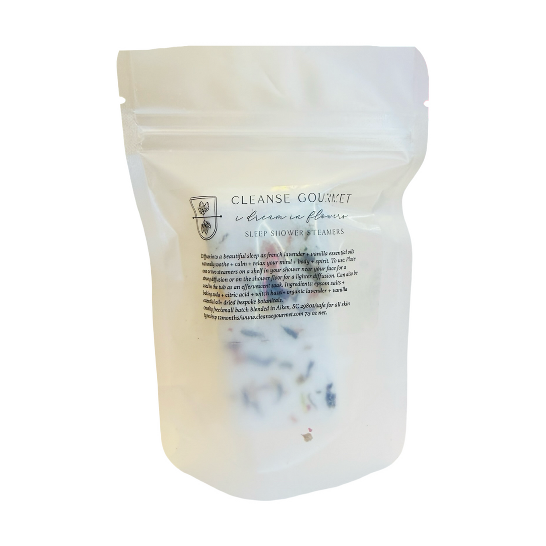 Resealable Cleanse Gourmet pouch of sleep shower steamers with dried botanicals visible inside.